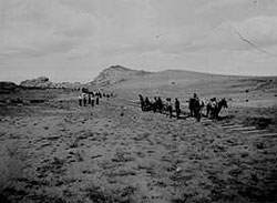 Laying tracks on the Prescott and Eastern Railroad in Arizona Territory, circa 1898