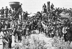 The driving of the golden spike, signifying the completion of the Transcontinental Railroad