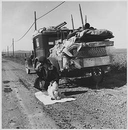 Farmers fleeing Oklahoma for California along Route 66, circa 1935. 