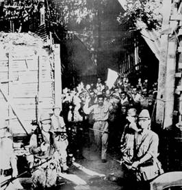 American soldiers surrendering on Corregidor to the Japanese after the fall of Bataan in April 1942
