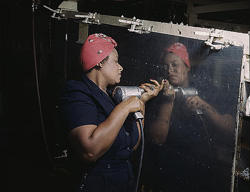 A woman working on a dive bomber