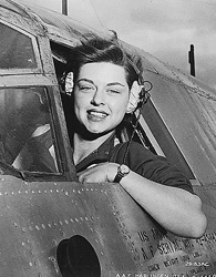 A woman in the cockpit of a bomber