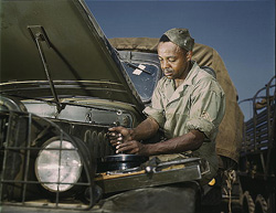 Military mechanic working on a vehicle