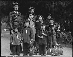 Dorothea Lange photograph of a family waiting to go to an internment camp